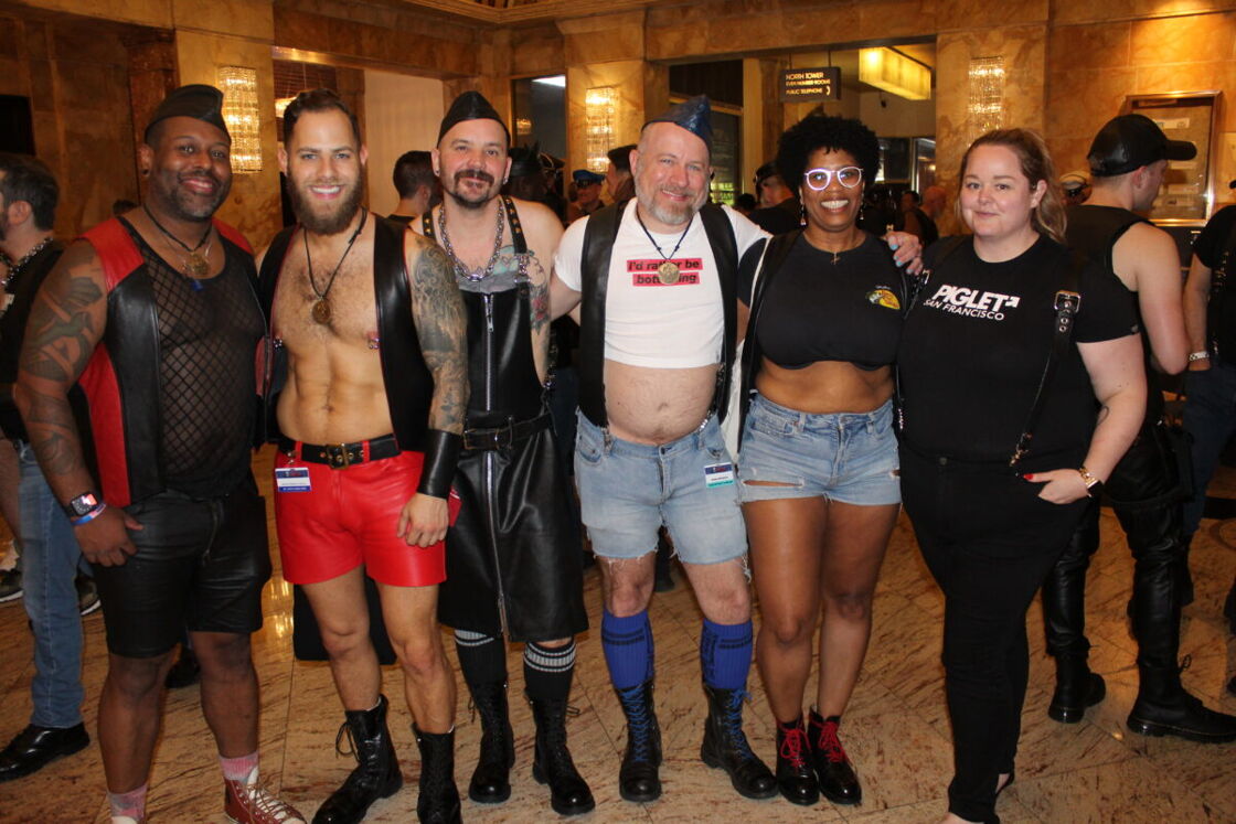 Four men and two women pose for teh camera in a variety of outfits.