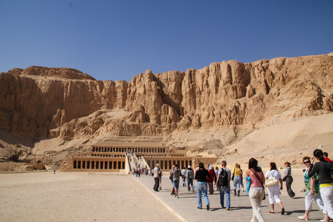 A line of tourists entering an attraction in Egypt. 