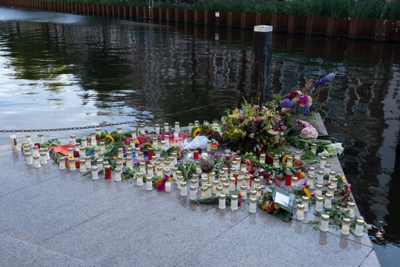 Flowers and candles honoring a vigil at Homomonument.