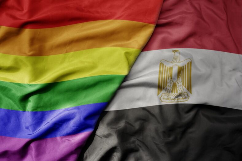 The Pride flag waving against the Egyptian flag to show unity. 
