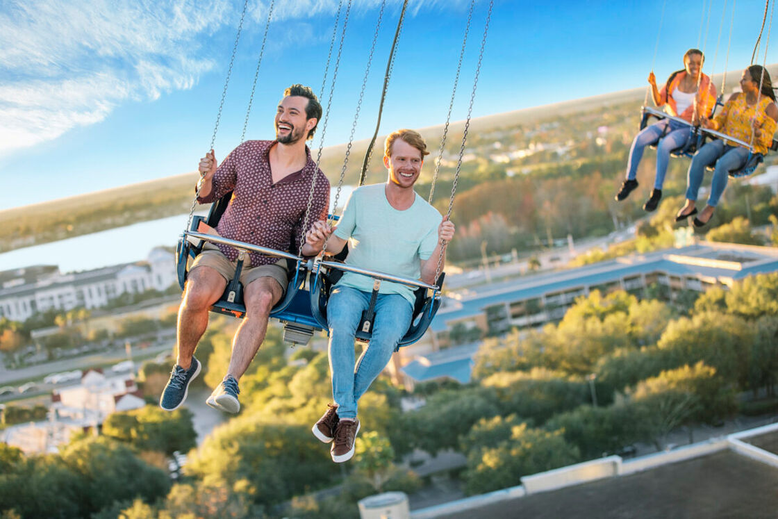 Gay couple riding the Orlando Starflyer at ICON Park