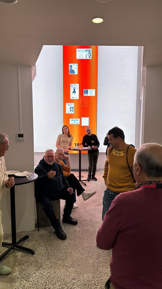 A group of Qtopia volunteers discussing museum matters.