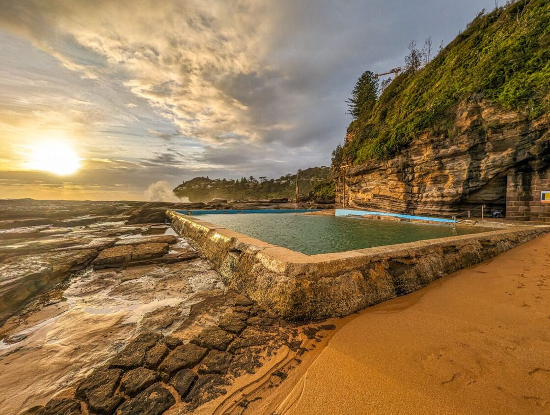Whale Beach rock pool at sunrise. Water is calm and green. One of Sydney’s many rock pools