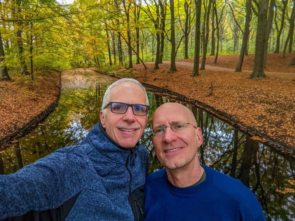 Michael Jensen and Brent Hartinger stand outside in The Hague, Netherlands