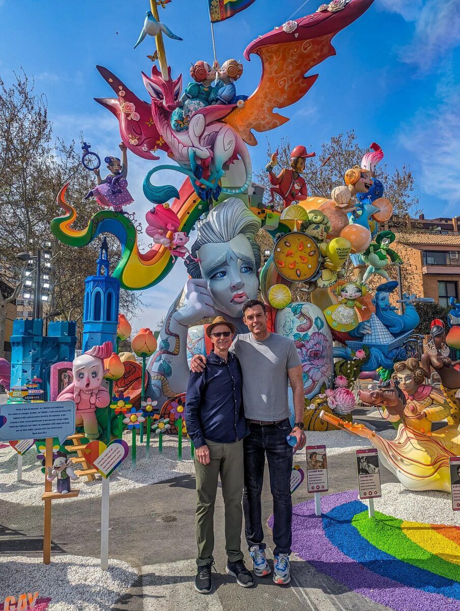 Michael and Mario posing in front of Mama, soy gay.