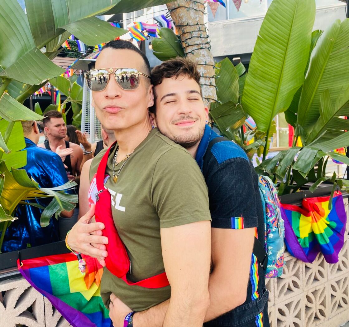 Local WeHoans Marcus Conover and Nick Angelillis cuddling on Santa Monica Blvd.