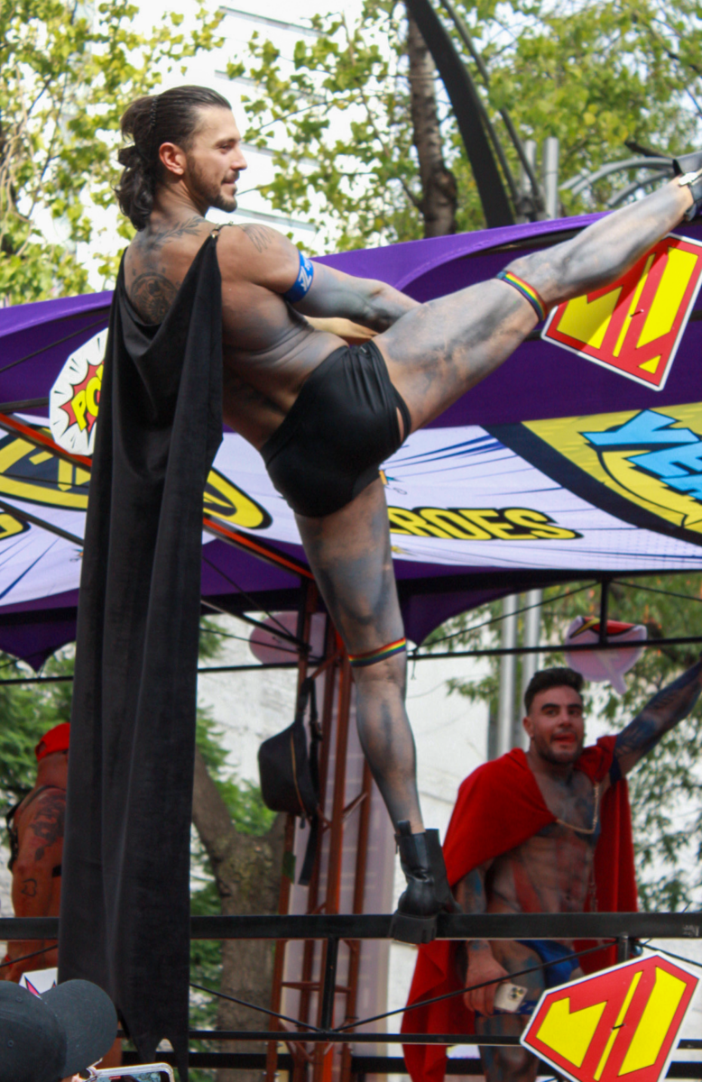 Gay man dancing from one the trucks at the parade.