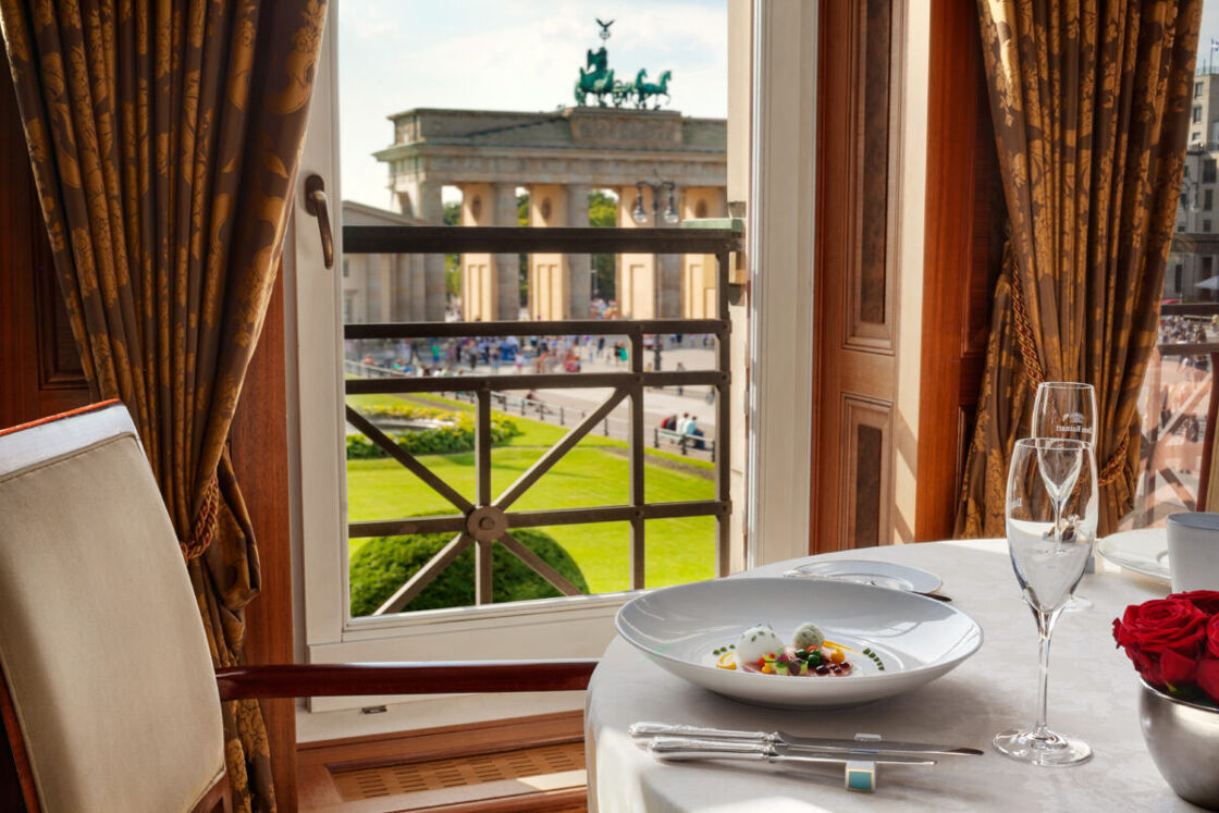 A view of the Brandenburg Gate through a window at Chef Lorenz Adlon Esszimmer's restaurant