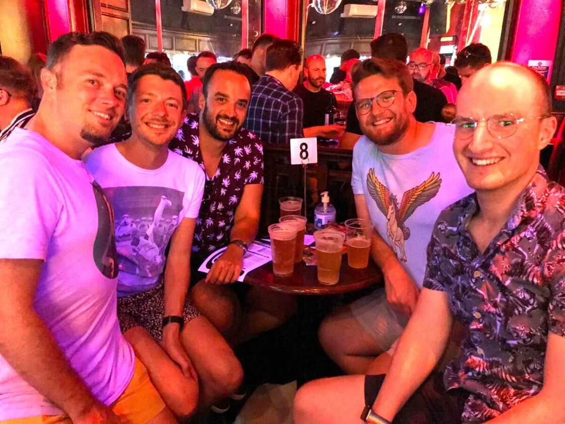 A group of five friends having pints of beer at Royal Vauxhall Tavern