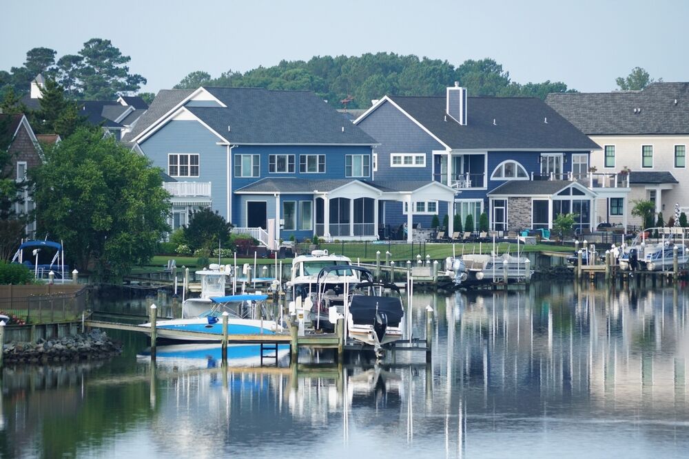 A view of the luxury waterfront homes with boat lifts by the bay at Rehoboth Beach