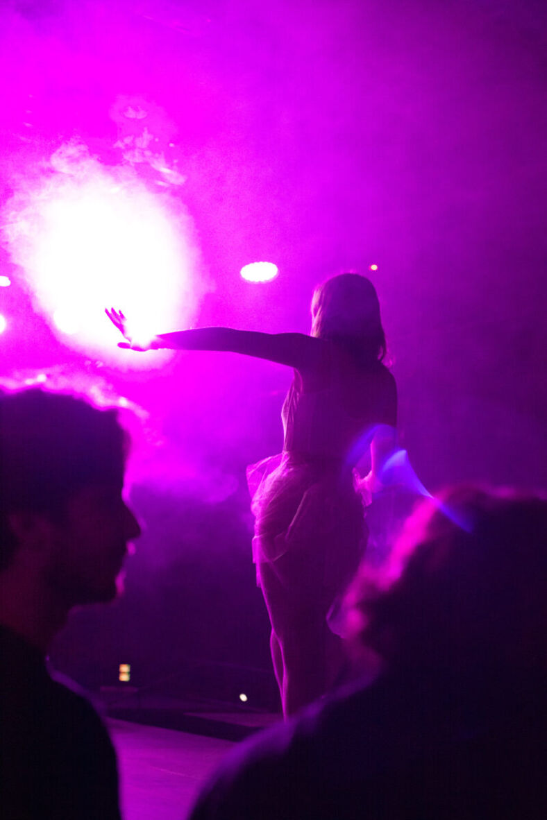 One of the organizers takes her moment in the spotlight for a photo opportunity before the ball starts