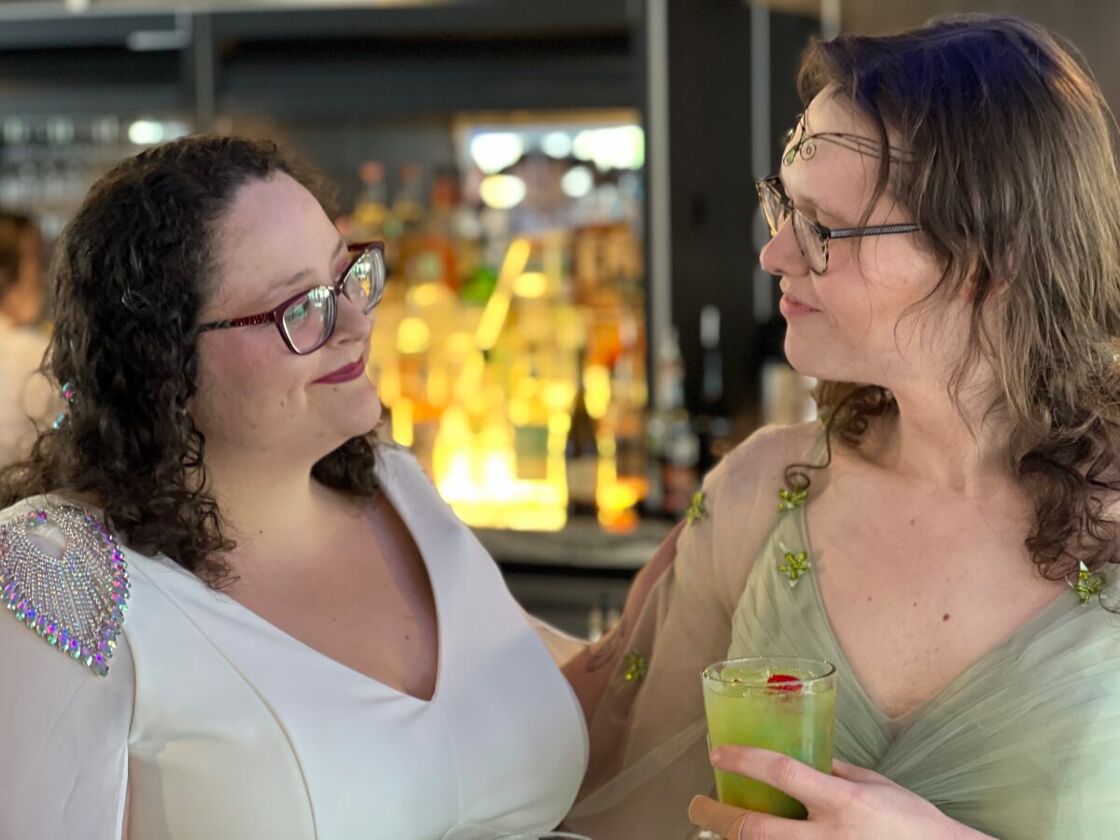A couple aboard Seattle's Love For All Boat vow renewal and Pride celebration.