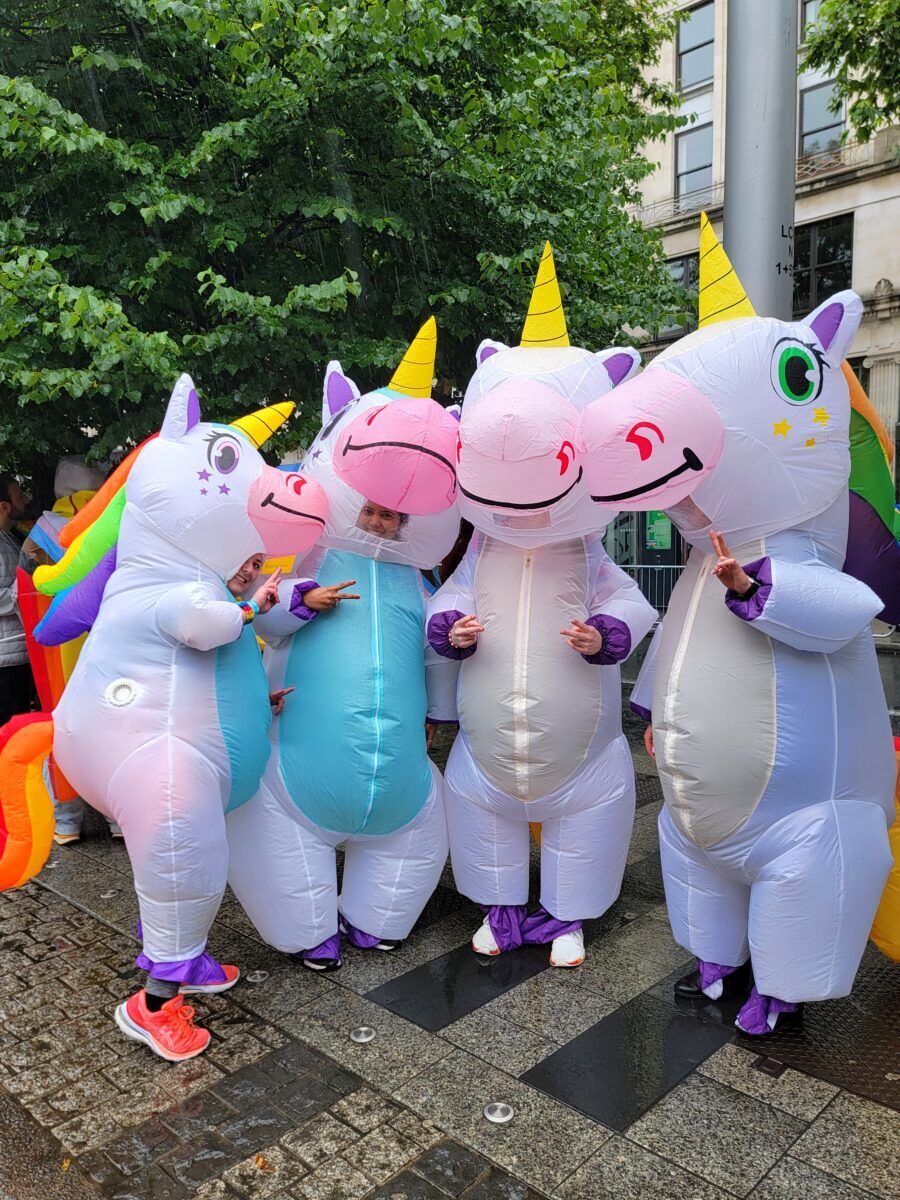 Four blow up unicorn suits