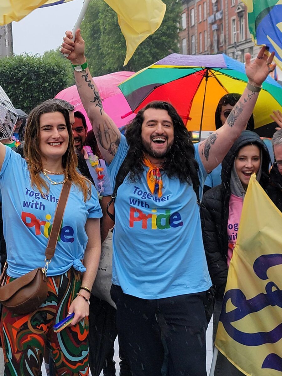 A group stands with Pride t-shirts