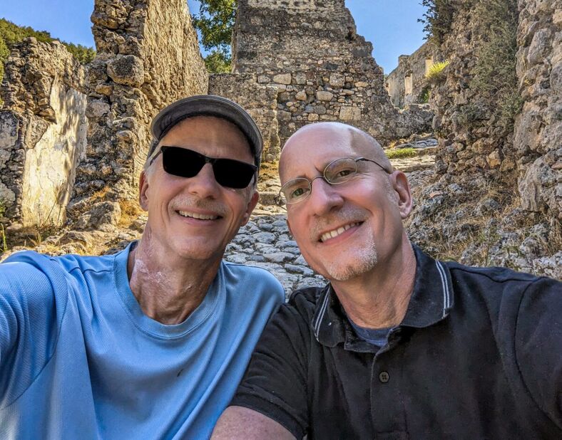 Michael Jensen and Brent Hartinger pose in front of stone ruins in Turkey