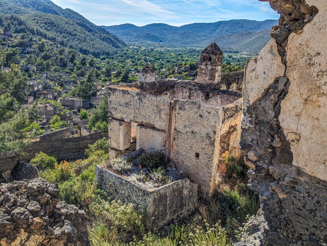 A photo of a crumbling video on the side of a mountain