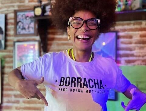 An excited woman wearing a white t-shirt