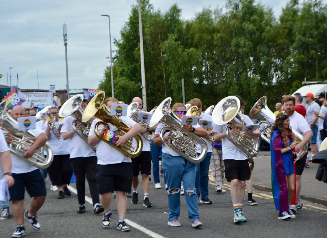 A lively brass marching band along the march.