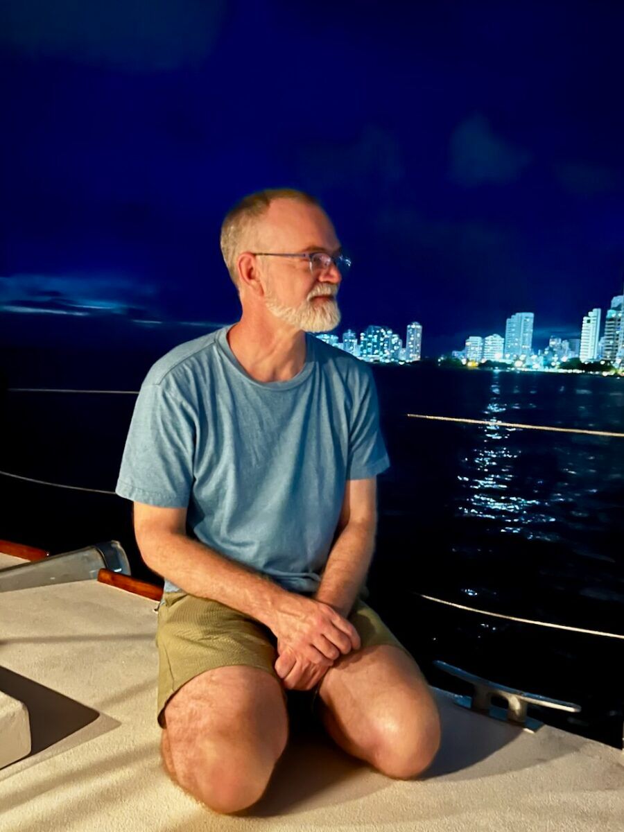 Bil Browning lounges on a catamaran in Cartagena Bay.