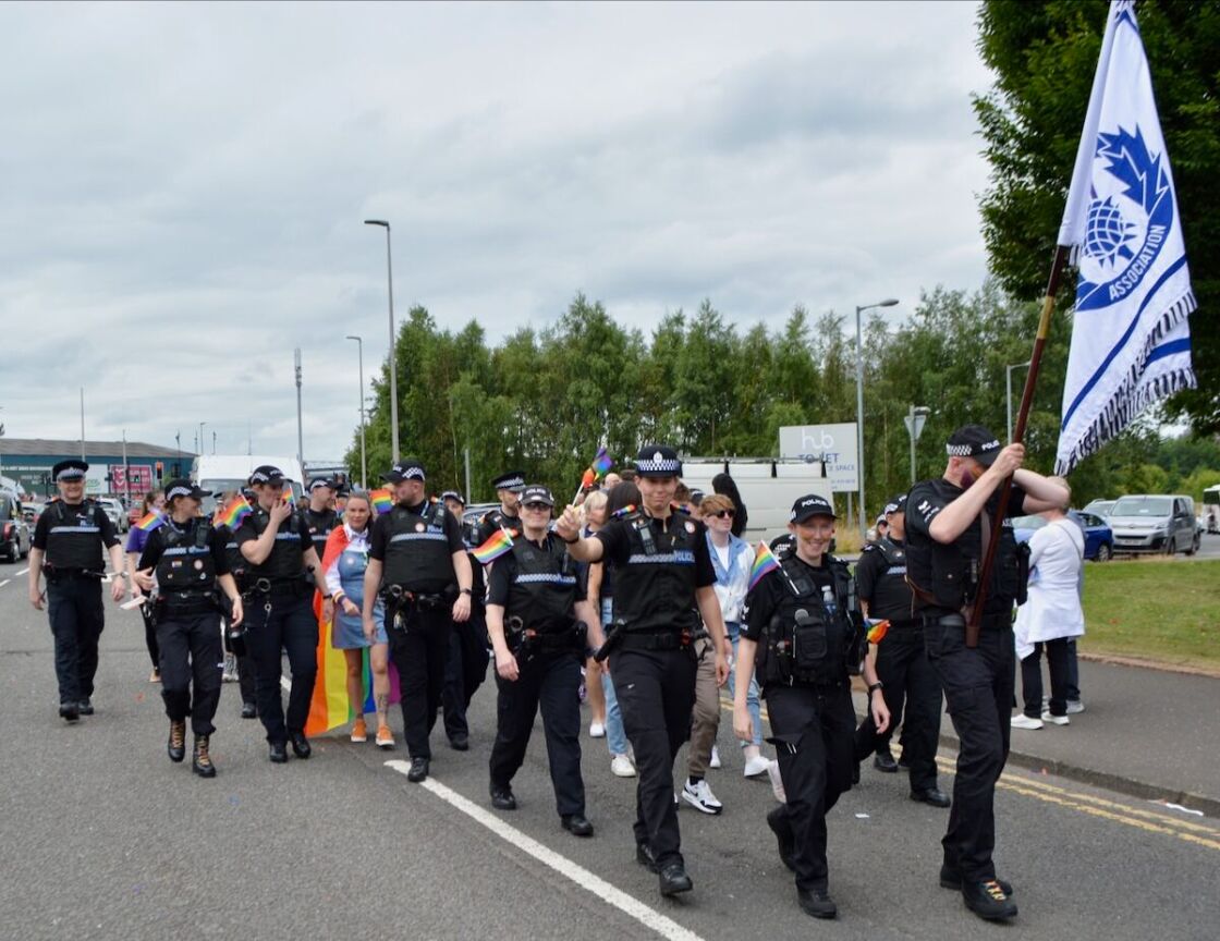 Uniformed members of Police Scotland join in the march.