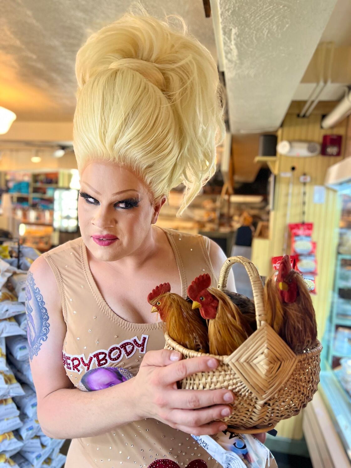 Nina West poses with a basket full of fake chickens