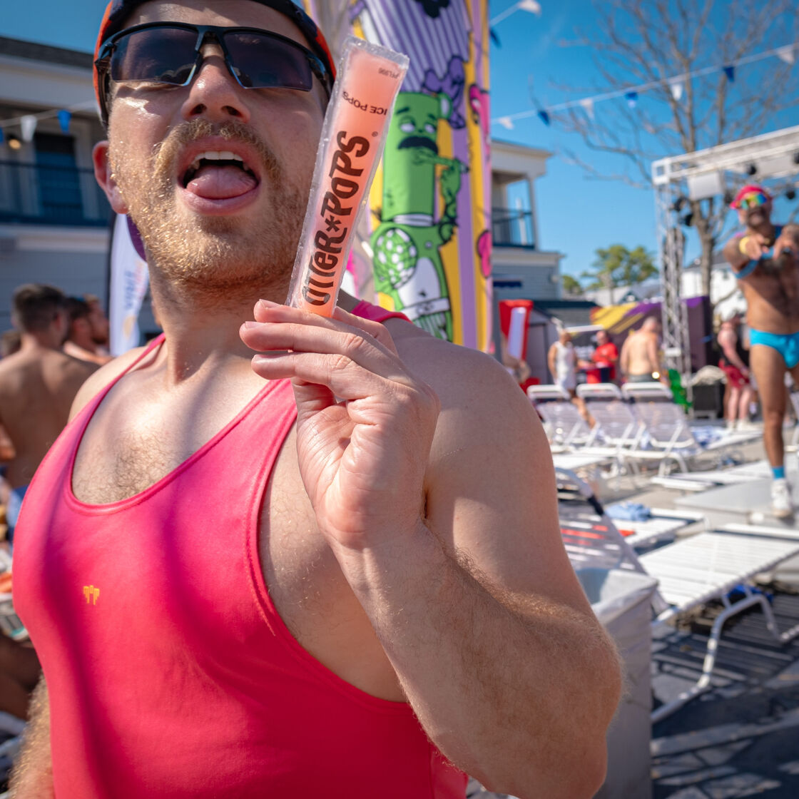 Man eating a popsicle.