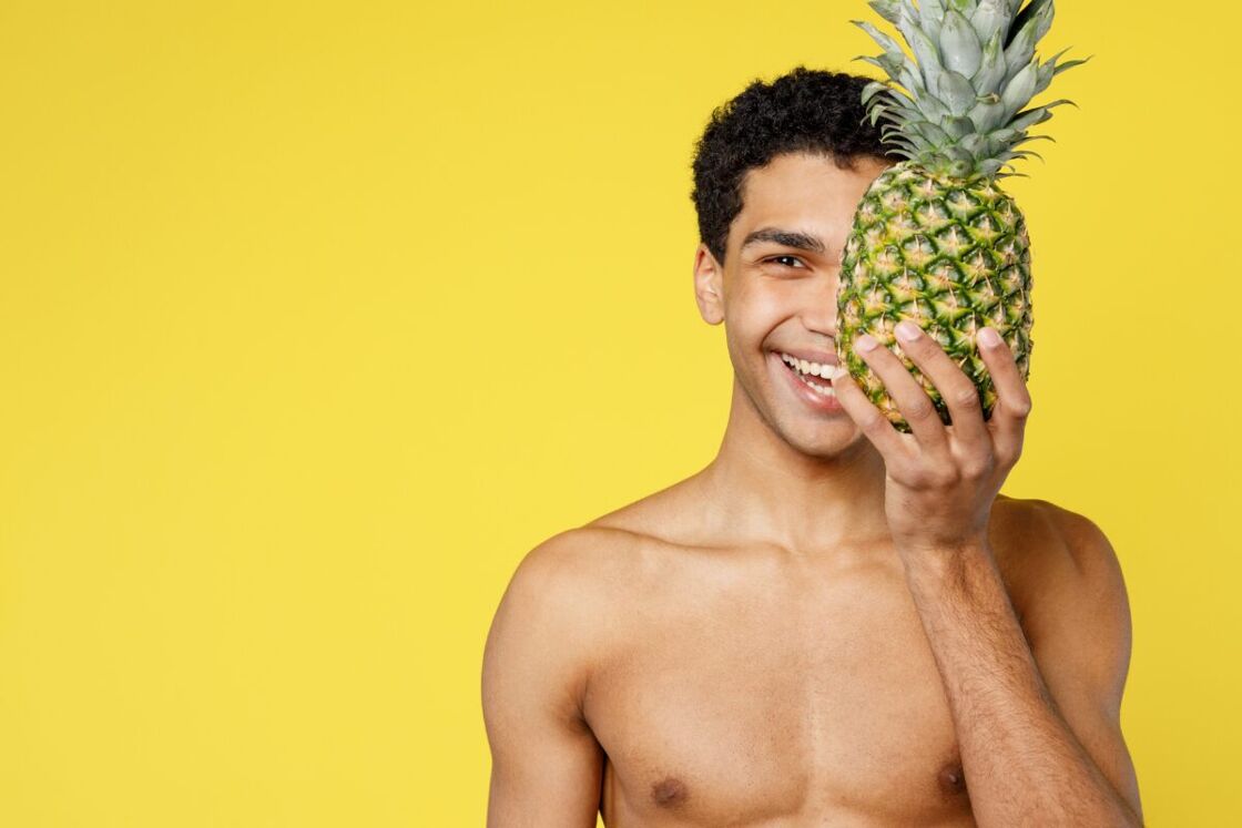 Man holding a pineapple 