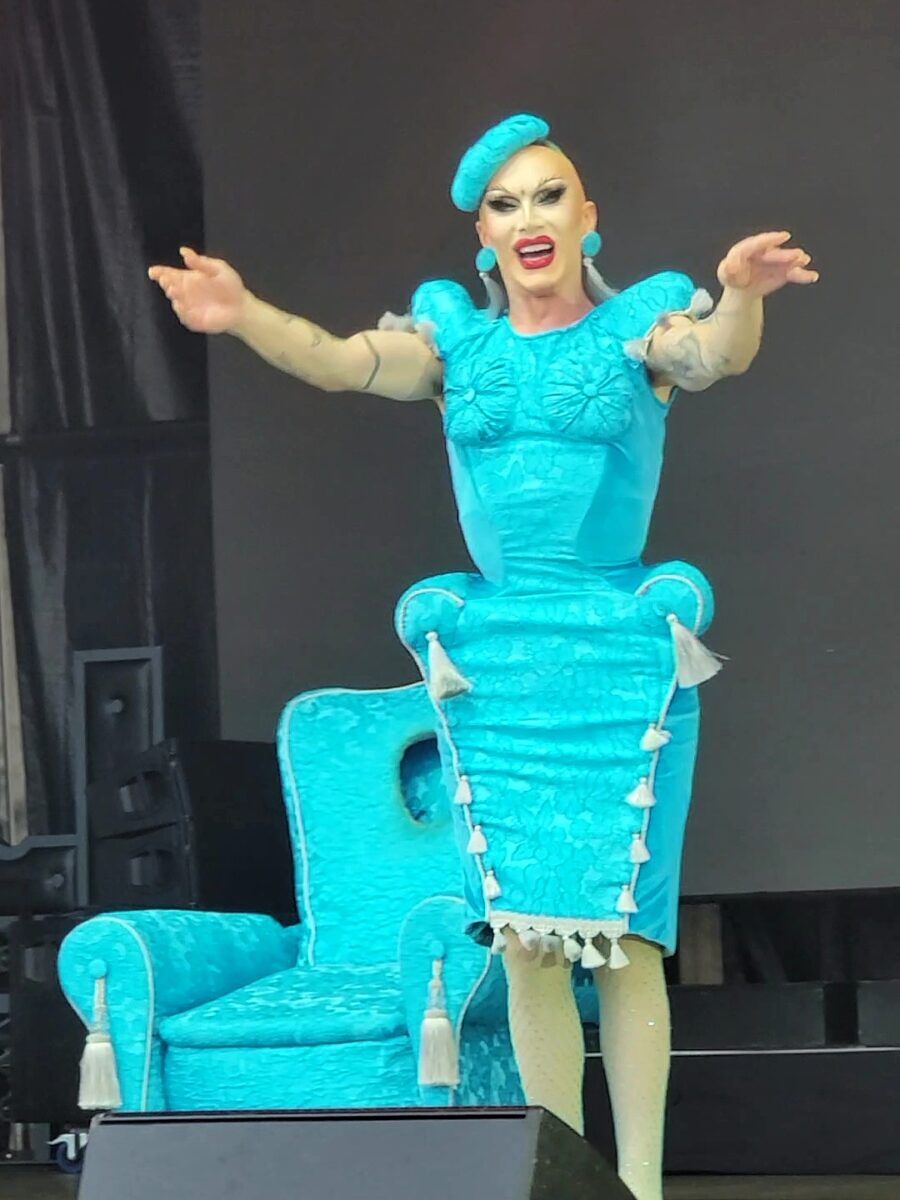 Sasha Velour in a bright blue dress