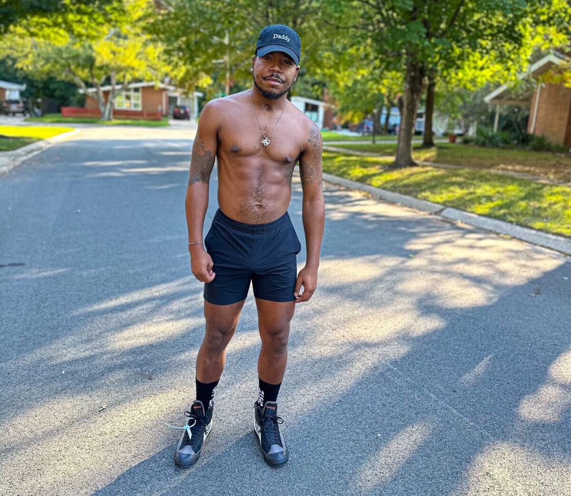 Shaun Clark stands in the street outside his home in DC