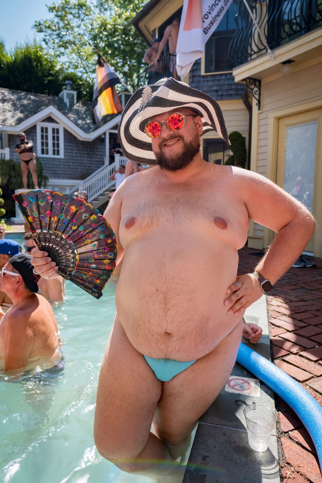 Man in a Speedo posing with his hands on his hips.