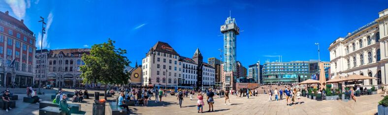 Plaza in downtown Oslo filled with crowds. 