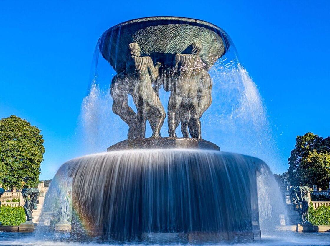 The Fountain under a blue sky A fountain at Vigeland Sculpture Park
