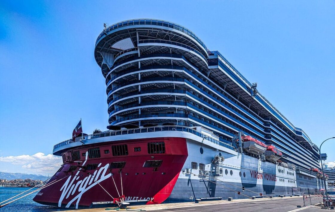 The stern of the Scarlet Lady shown at port The Scarlet Lady docked in port.