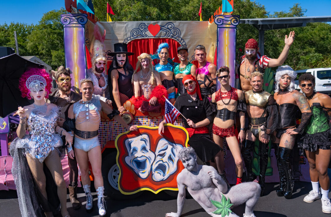 A group of float goers pose proudly