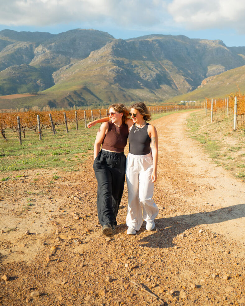 Gabi and Shanna walk down a dirt road