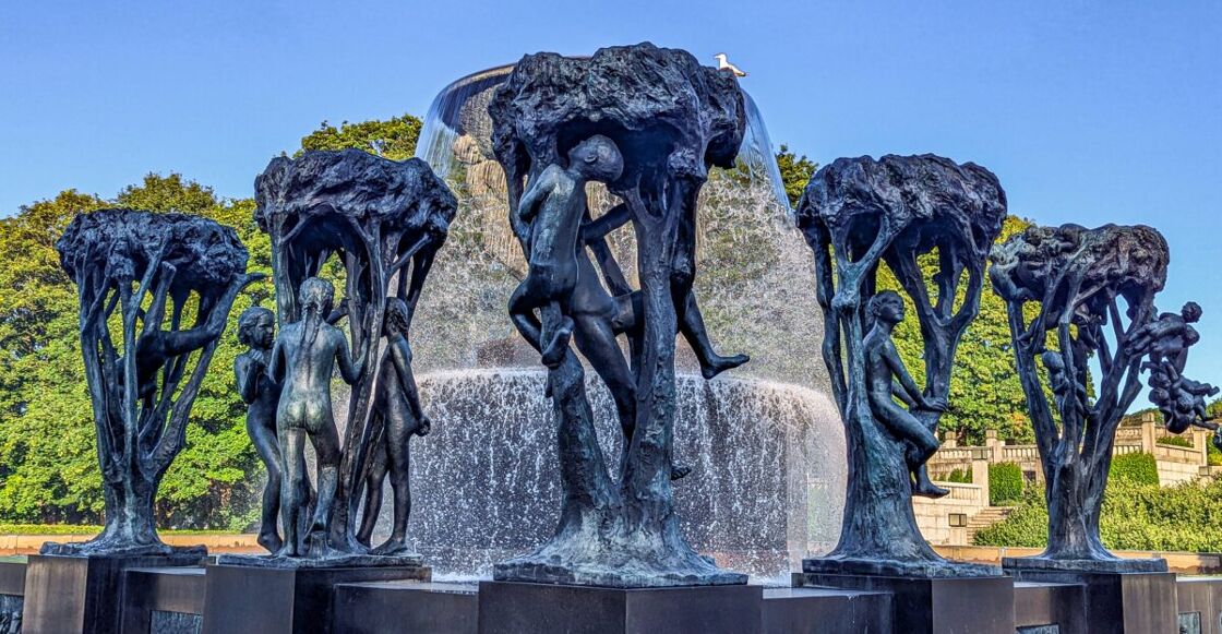The trees around the Fountain, each one filled with babies or children. Statues surround the fountain at Vigeland Sculpture Park