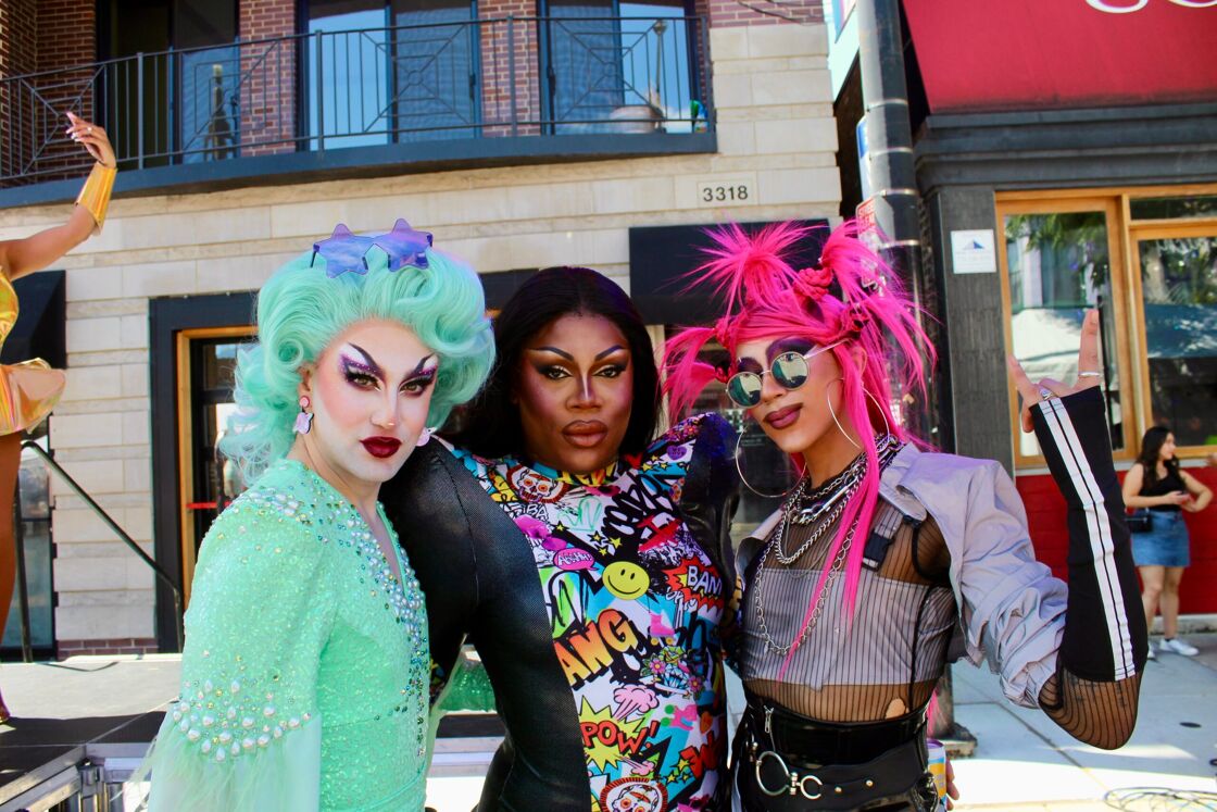 Three drag queens pose for the camera at the Chicago Market Days festival