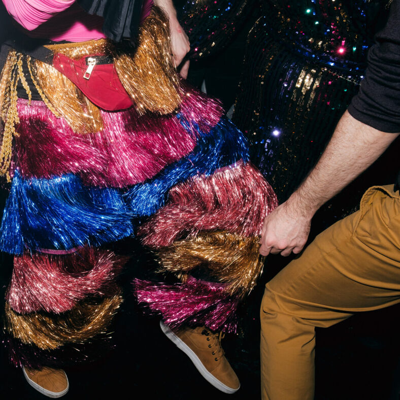 Closeup shot of a persona's sparkly multicolored pants