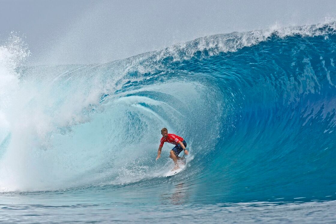 Man surfing in Teahupoʻo, Tahiti.