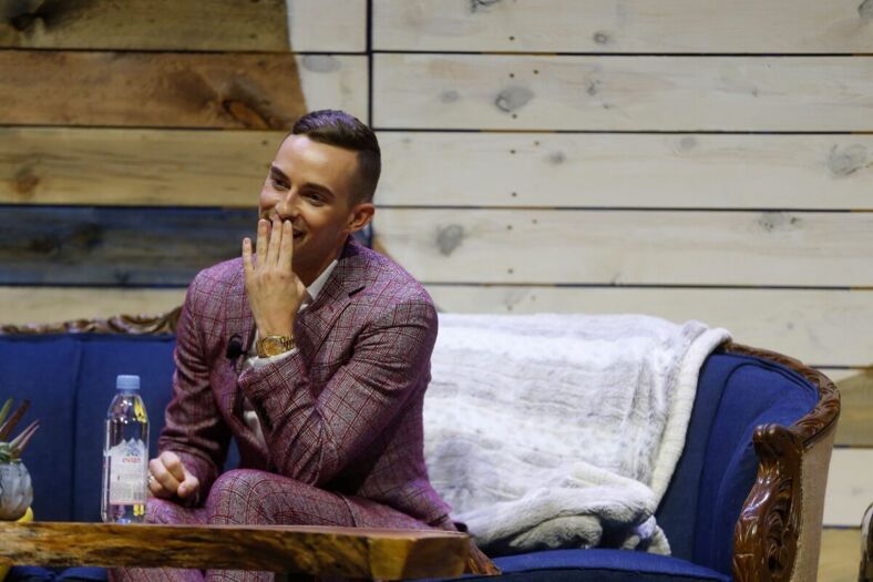 Olympic figure skater Adam Rippon (right) pauses Saturday, Aug. 4, 2018, as he speaks on stage at the Newbo Evolve festival in Cedar Rapids, Iowa.