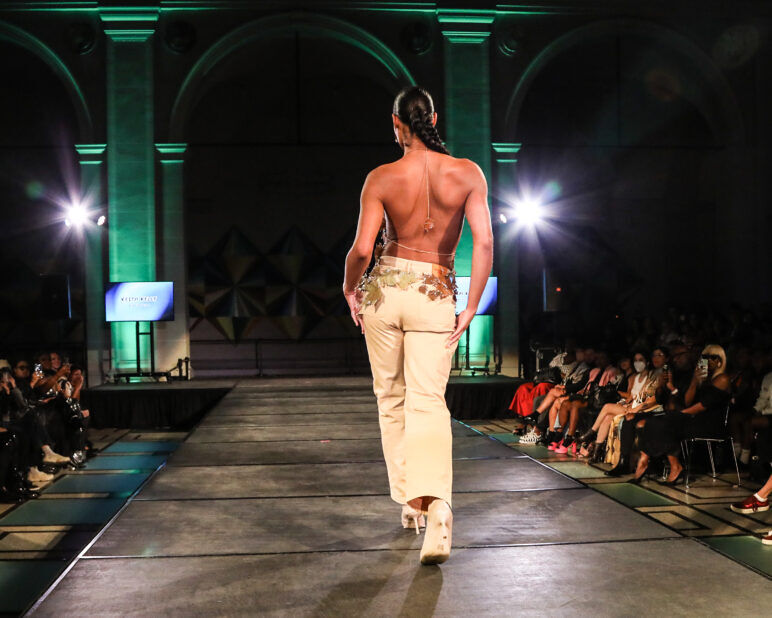 A model wears an outfit from KEITH KELLY at the dapperQ fashion show during New York Fashion Week