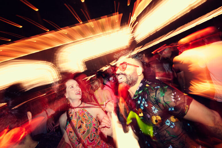 A blurred photos of a woman and man dancing at DISCOWORLD