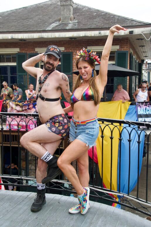 Two friends pose fashionably and with silly smiles on their faces