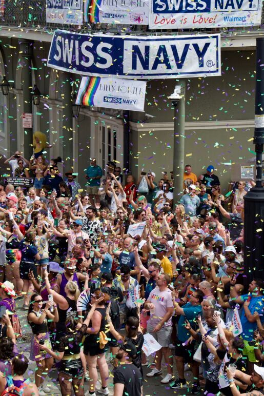 Bourbon Street is filled with people and confetti