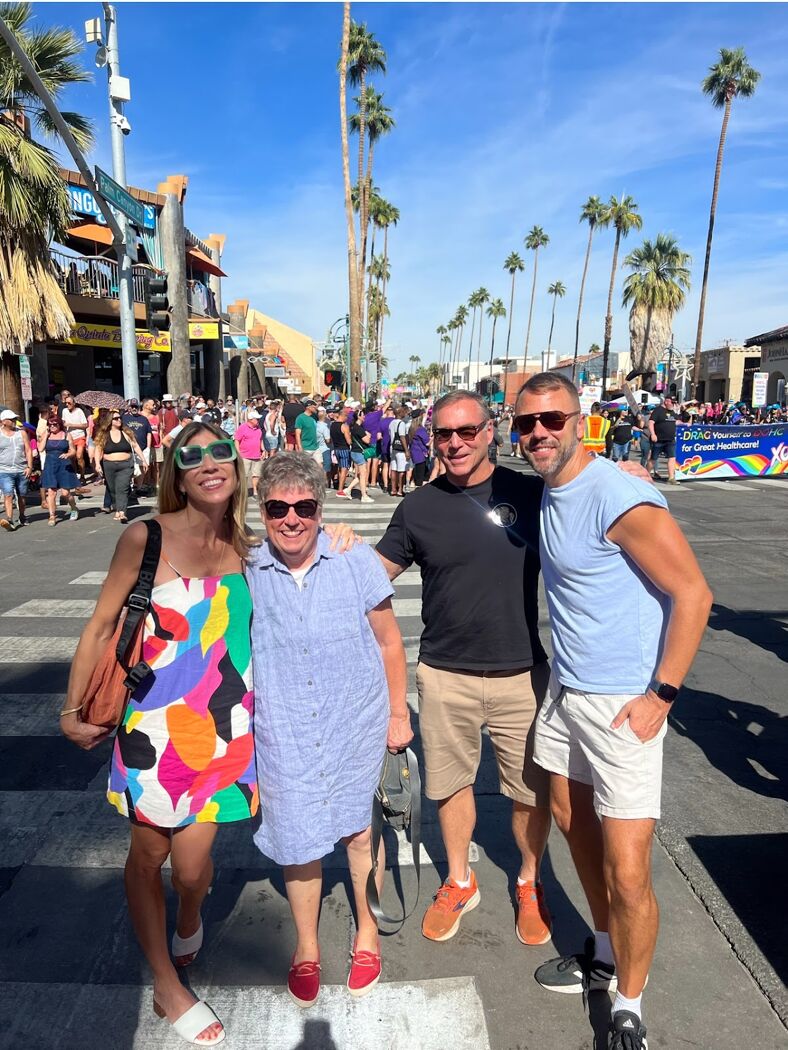 John Halbach poses for a photo in Palm Springs with his sister, mom, and dad.