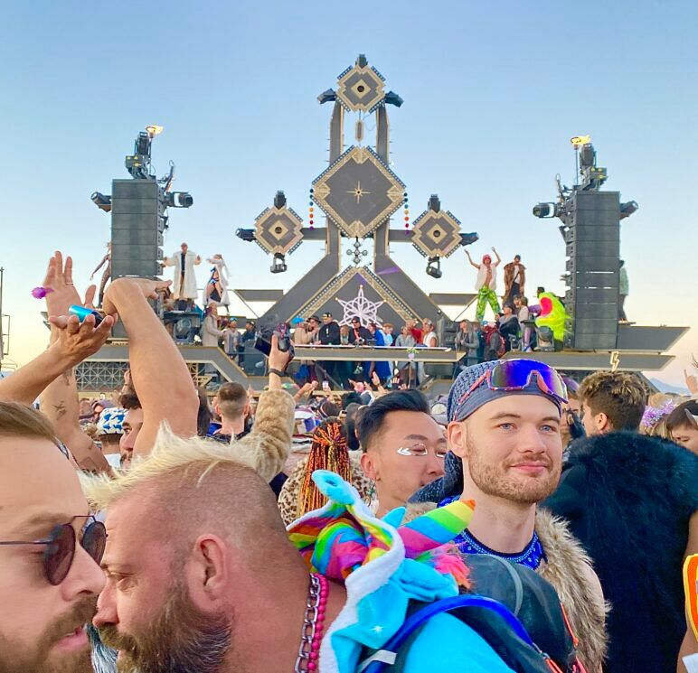 Queer Burners grtooving to a sunrise set hosted by the new Mayan Warrior art car.