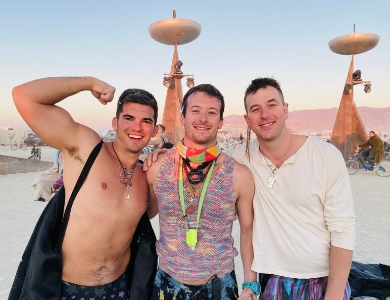 Virgin Burner Young Matty sandwiched between GI Joey and Charles at Mayan Warrior's sunrise set early Thursday morning.
