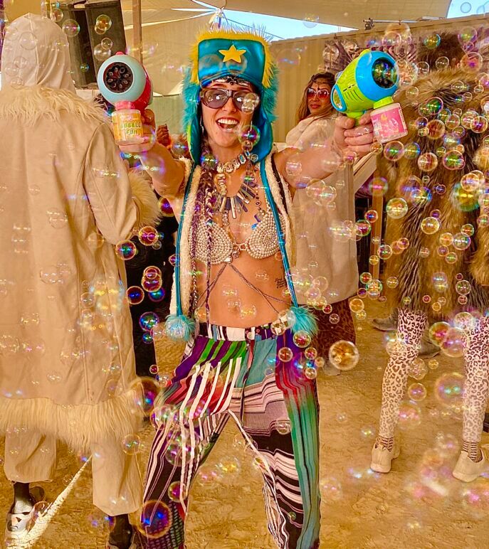 A playa tradition of the Burn is to post-game at the Bubbles and Bass camp after a night of partying. While revelers sip on champagne and lounge to mellow beats, this Burner respect the theme with her kitschy bubble gun. 