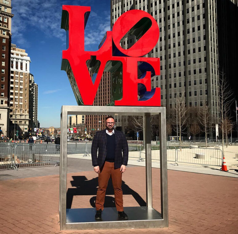 JJ Keyes stands under the iconic LOVE statue in Philadelphia