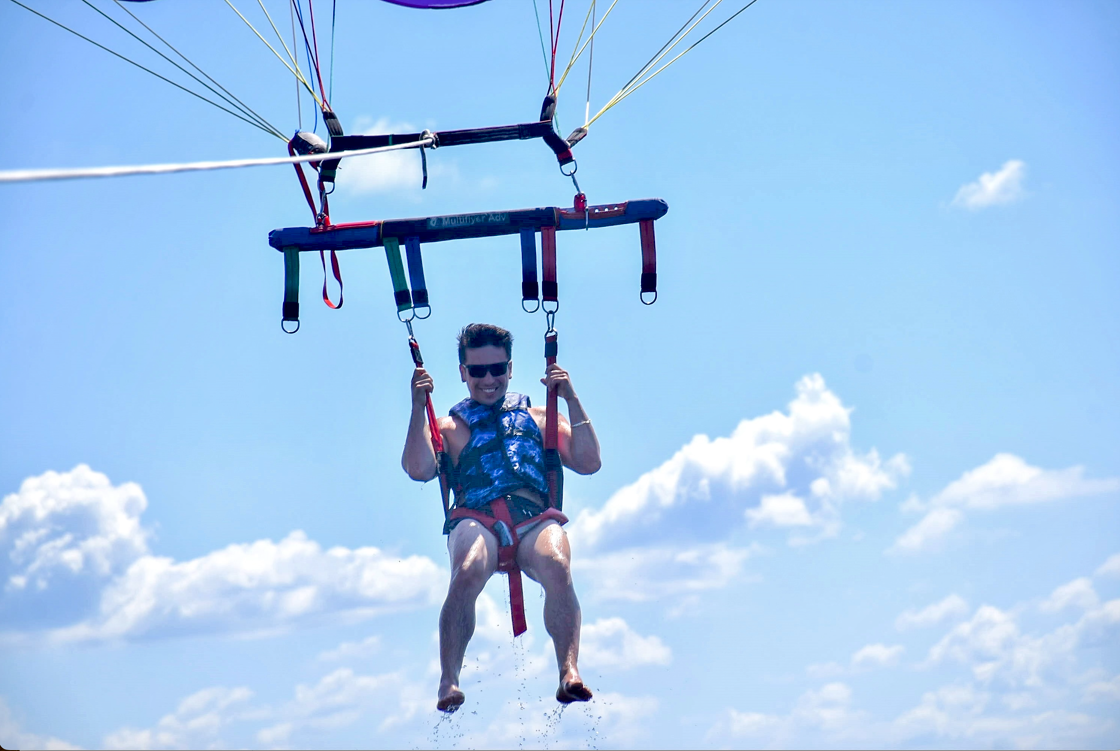 Author parasailing Panama City with water dripping from his feet. 